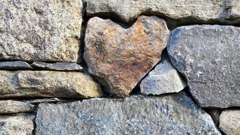 Heart shaped stone in wall